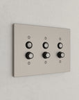 Solid brass Futura Push Button Wall Plate – Triple in Satin Nickel finish