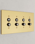 Solid brass Futura Push Button Wall Plate – Quad in Polished Brass finish