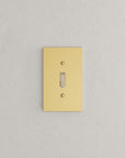Solid brass Futura Toggle Wall Plate in Polished Brass finish