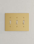 Solid brass Futura Toggle Wall Plate – Triple in Satin Brass finish