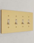 Solid brass Futura Toggle Wall Plate – Quad in Satin Brass finish