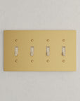 Solid brass Futura Toggle Wall Plate – Quad in Satin Brass finish