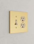Solid brass Futura Toggle & Outlet Wall Plate – Double in Polished Brass finish