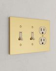 Solid brass Futura Toggle & Outlet Wall Plate – Triple in Polished Brass finish
