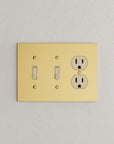 Solid brass Futura Toggle & Outlet Wall Plate – Triple in Polished Brass finish