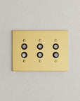 Solid brass Futura Push Button Wall Plate – Triple in Polished Brass finish