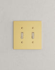 Solid brass Futura Toggle Wall Plate – Double in Polished Brass finish