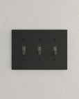 Solid brass Futura Toggle Wall Plate – Triple in Coal Black Brass finish