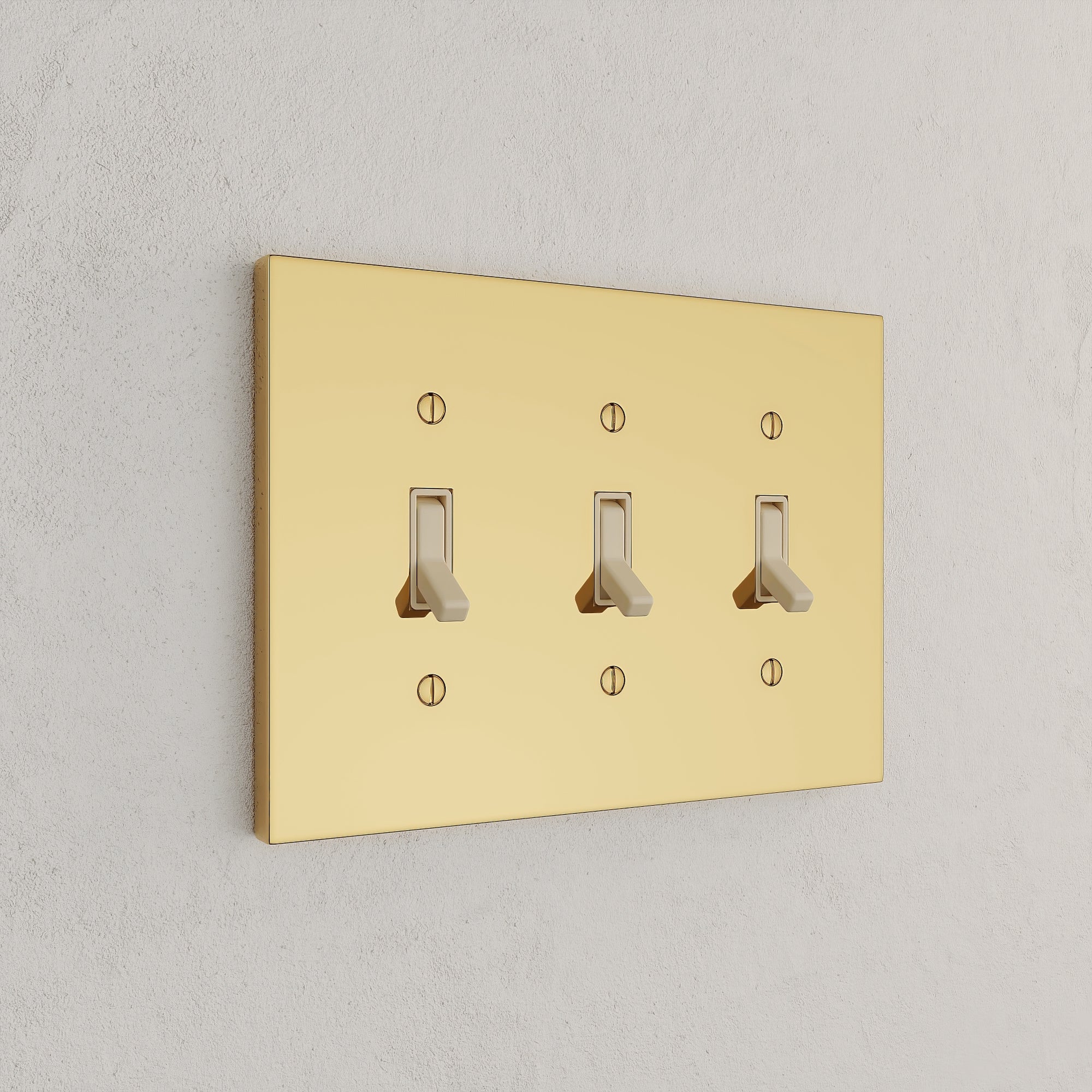 Solid brass Futura Toggle Wall Plate – Triple in Polished Brass finish