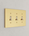 Solid brass Futura Toggle Wall Plate – Triple in Polished Brass finish
