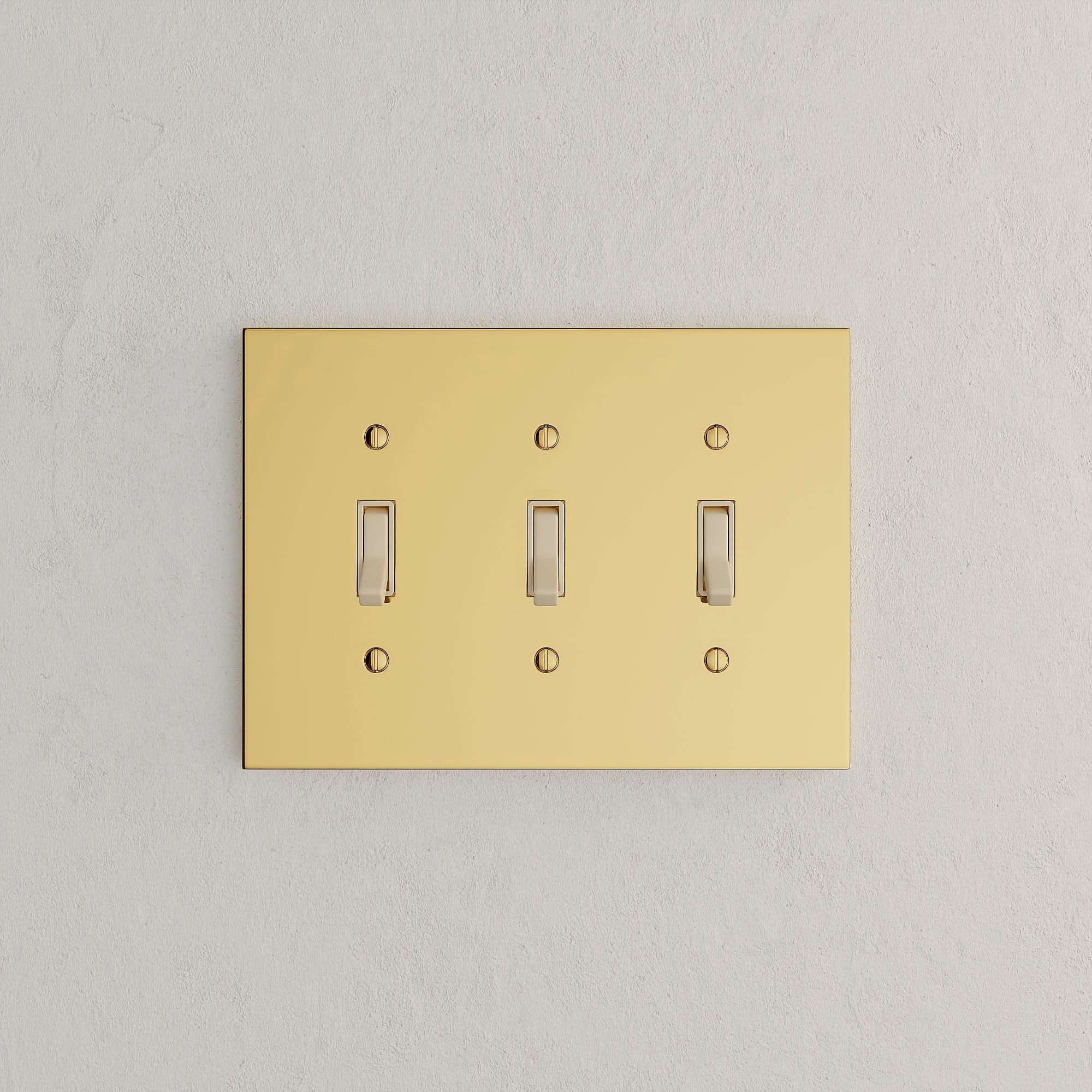 Solid brass Futura Toggle Wall Plate – Triple in Polished Brass finish